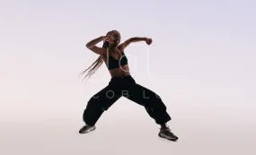 Confident gen z dancer exuding energy and flexibility in studio performance